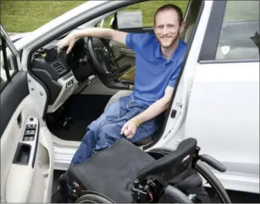  ?? KATIE ROUPE – OBSERVER-REPORTER VIA AP ?? Matt Taylor, TRIPIL Membership director, shows his Subaru Impreza Hatchback that has been modified for his needs with hand controls and other items during n Adaptive Vehicle Car Show hosted by TRIPIL.