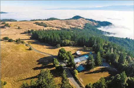  ?? Photograph­s by Myung J. Chun Los Angeles Times ?? IN HUMBOLDT COUNTY, fog covering low-lying coastal towns can be seen from the mountains near the community of Kneeland.