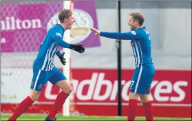  ??  ?? TWO IN TWO: Kilmarnock’s Sean Longstaff (left) celebrates scoring his second goal in as many matches with team-mate Rory McKenzie.
