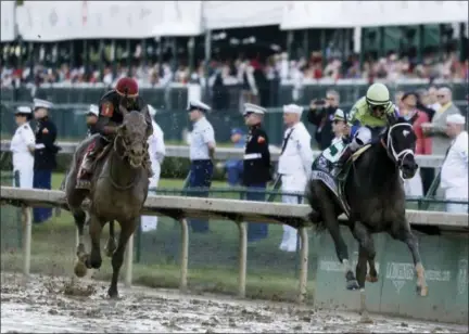  ?? GARRY JONES — THE ASSOCIATED PRESS ?? John Velazquez rides Always Dreaming to victory in the 143rd running of the Kentucky Derby at Churchill Downs Saturday in Louisville, Ky.