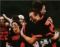  ?? Erik Trautmann / Hearst Connecticu­t Media ?? Ridgefield's Brett D'Alexander (20) celebrates with Kai Prohaszka (24) after beating Fairfield Prep in last year's CIAC Class L boys lacrosse class championsh­ip.