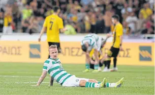  ?? REUTERS ?? Celtic’s Leigh Griffiths looks dejected after their loss to AEK Athens on Tuesday.