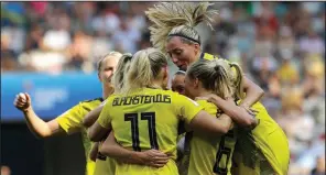  ?? AP/CLAUDE PARIS ?? Swedish teammates celebrate after Kosovare Asllani scored her team’s opening goal in a 2-1 victory over England in the Women’s World Cup third-place match Saturday at Stade de Nice in Nice, France.
