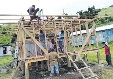  ?? Photo: DEPTFO News ?? Trainees assisting in building a house.