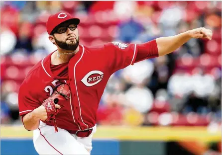  ?? DAVID JABLONSKI / STAFF ?? Cody Reed was one of seven rookies to make the 2017 opening-day roster but spent most of the year in Triple-A. He made 20 starts there and returned to the Reds in September, making seven appearance­s in relief. He finished 1-1 with a 5.09 ERA for...