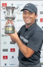  ??  ?? PRIZE GUY: Francesco Molinari of Italy celebrates with the trophy.