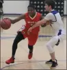  ?? COURTESY PHOTO ?? Vallejo High senior Deven Johnson (left) drives to the hoop in a recent game this month.