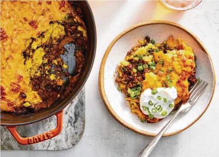  ?? FOOD STYLED BY BARRETT WASHBURNE. PHOTOS BY RYAN LIEBE/THE NEW YORK TIMES ?? Vegetarian tamale pie is shown in New York. A bean-based chili and a little bit of spice bring this retro casserole into the modern age.