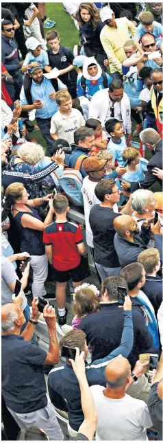  ??  ?? Raised profile: Eoin Morgan receives welcome attention at the Oval yesterday after leading his men to glory