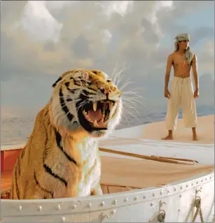  ??  ?? Tiger feat: Suraj Sharma stars in Ang Lee’s adventure based on Yann Martel’s novel.