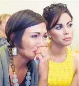  ?? GREG SORBER/JOURNAL ?? Alicia Marcell, left, is comforted by family friend Lori Ann McBride, at the plea agreement hearing in the beating of her sister.