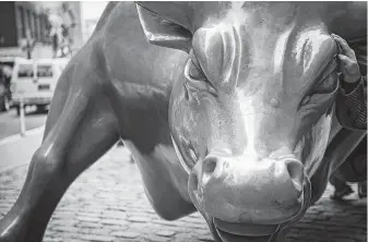  ?? Bryan R. Smith / AFP / Getty Images file ?? Wall Street stands at the cusp of the longest bull market on record this week.