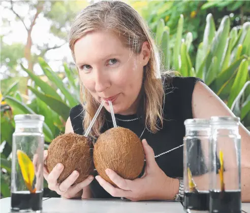  ?? Picture: LIAM KIDSTON ?? LOW-IMPACT CROP: Lead researcher Julianne Biddle of the University of Queensland’s St Lucia campus is part of the Coco-BIO group that has made advances in cloning coconuts, opening up the potential for a fast-growing industry,
