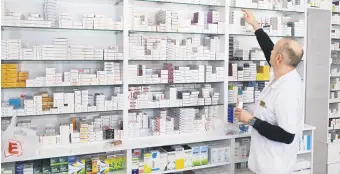  ?? ?? A pharmacist is seen picking out some medicine boxes from a rack in a pharmacy, Konya, Türkiye, March 29, 2024.