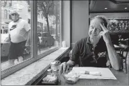  ?? CHARLES REX ARBOGAST/AP PHOTO ?? Chicago Alderman Tom Tunney poses inside his main Ann Sather restaurant in Chicago. Tunney estimates he’s put $250,000 of his own money into running his three Ann Sather restaurant­s.