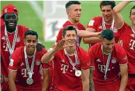  ??  ?? Sarpreet Singh, second from left, celebrates with his Bayern Munich teammates.