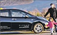  ??  ?? Scott and his daughter Emily with the Nissan Leaf electric taxi.