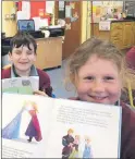  ??  ?? Enjoying their reading on World Book Day were Tadhg and Sophie.