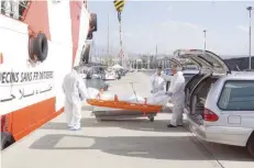  ?? — AFP ?? The bodies of six migrants arrive at the port of Catania a day after being found at sea by NGO Medecins Sans Frontieres (MSF) as part of a rescue operation of migrants and refugees off the Libyan coasts on Friday.