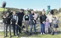  ?? PHOTO: SUPPLIED ?? #Fiveways . . . Cast and crew of a short film created for Mental Health Awareness Week (from left) NHNZ crew members Ora Simpson, Berenice Mathieu and Tom Koykka, Orokonui educator Tahu Mackenzie, Kokiri Training Centre tutor Tama Samuel with his daughter Isabella (3), actor and Kokiri student Lisa Candace Obbeek and her daughter Billie Ellison (5), King’s High School pupil Taumana Pene (17) and his younger brother Kaiahi Waititi (8) stand outside the skink enclosure at Orokonui.