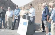  ?? CHITOSE SUZUKI — LAS VEGAS REVIEW-JOURNAL VIA AP ?? Kyle Roerink of Great Basin Water Network, center, speaks during a news conference at the Hoover Dam on the Arizona side on Thursday to share demands for managing the shrinking Colorado River.