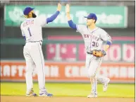  ?? Greg Fiume / Getty Images ?? Michael Conforto of the Mets, right, celebrates with Amed Rosario after Sunday’s win over the Nationals in Washington.