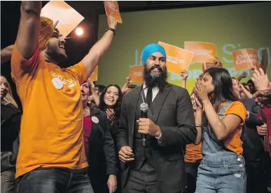  ?? CHRIS YOUNG/THE CANADIAN PRESS ?? NDP leadership contender Jagmeet Singh on stage with supporters after speaking in Hamilton, Ont., earlier this month. Bloc Québécois Leader Martine Ouellet has said that by wearing a turban, Singh is promoting religious values.
