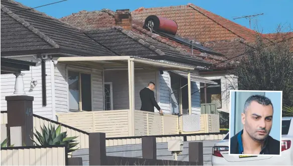  ?? Picture: AAP IMAGE/BRENDAN ESPOSITO ?? A detective is seen outside a home in Beverly Hills, Sydney, as raids were carried out over the death of ex-bikie boss Mick Hawi (inset).
