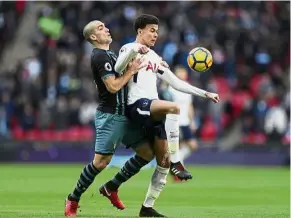  ??  ?? Back off: Tottenham’s Dele Alli shielding the ball from Southampto­n’s Oriol Romeu during the English Premier League match at Wembley on Tuesday — AP