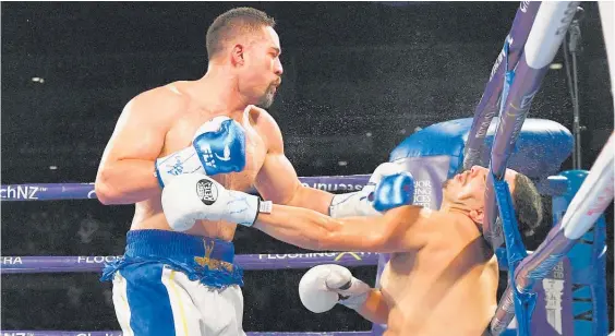  ?? Photos / Photosport ?? Joseph Parker turns out the lights for Alexander Flores in Christchur­ch on Saturday.