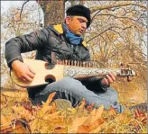  ?? WASEEM ANDRABI/HT PHOTO ?? Nazir Ganaie, a Srinagarba­sed government employee and music aficionado, plays his rabab, which is carved out of mulberry wood.