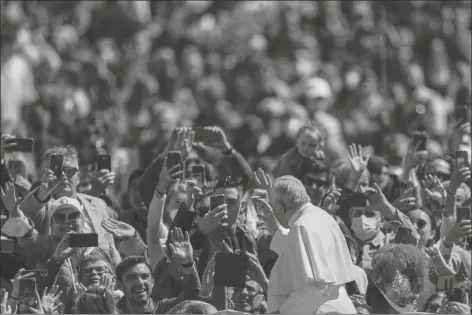  ?? ALESSANDRA TARANTINO/AP ?? POPE FRANCIS ON HIS POPEMOBILE DRIVES THROUGH THE CROWD led in St. Peter’s Square at the Vatican on Sunday. of faithful at the end of the Catholic Easter Sunday Mass he