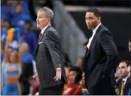  ?? MARK J. TERRILL — THE ASSOCIATED PRESS ?? In this file photo, Southern California head coach Andy Enfield, left, talks to officials as assistant coach Tony Bland stands behind him during the second half of an NCAA college basketball game against UCLA, in Los Angeles. After the NCAA tournament,...