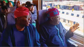  ?? ?? President Tinubu and Governor Sanwo-Olu taking a train ride