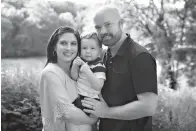  ?? Ash family photo via AP ?? ■ This undated photo shows Amber and Elliott Ash holding their son, Ethan. The couple has filed a class-action lawsuit against University Hospitals in Cleveland after its fertility clinic in suburban Cleveland discovered a storage tank malfunctio­n...