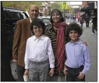  ?? AP file photo ?? Lenore Skenazy and her husband, Joe, pose in 2008 with her sons Izzy (right), 10, and Morry, 12, on a street in New York. Her chronicle of her son’s independen­t journey through the city was the start of a modern movement.