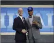  ?? FRANK FRANKLIN II — THE ASSOCIATED PRESS ?? Washington’s Markelle Fultz, poses with NBA Commission­er Adam Silver after being selected by the 76ers as the No. 1 pick.