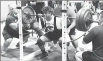  ??  ?? A Big Spring powerlifte­r works their way through a heavy squat lift last spring.
