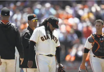  ?? Ezra Shaw / Getty Images ?? Johnny Cueto gave up five runs, all earned, and eight hits in six innings against the Dodgers. He can opt out of his six-year deal with the Giants after this season.