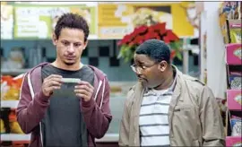  ?? Netf lix ?? REAL-LIFE BUDDIES Eric Andre (as Chris Carey) and Lil Rel Howery (as Bud Malone) hit the road in “Bad Trip,” a film that was hijacked by the pandemic.