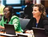  ?? ASHLEE REZIN/SUN-TIMES ?? Mashana Smith (left) and Colleen Cicchetti speak during the Illinois House Public Safety and Violence Prevention Task Force meeting Thursday at the Bilandic Building in the Loop.