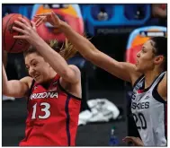  ?? (AP/Eric Gay) ?? Arizona guard Helena Pueyo (left) grabs a rebound Friday in front of Connecticu­t forward Olivia Nelson-Ododa during the second half of the Wildcats’ 69-59 victory over the Huskies in San Antonio. More photos at arkansason­line.com/43ncaawome­n/.