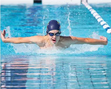  ??  ?? Patrick Griffin flies towards the wall in his 100m butterfly event in perfect conditions for the Victorian Country Championsh­ips.