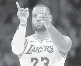  ?? MARCIO JOSE SANCHEZ/AP ?? LeBron James helped create one super team with the Heat. Can he do it again with the Lakers?