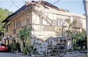  ??  ?? The damaged roof of a house in Ilocos Sur province on Wednesday