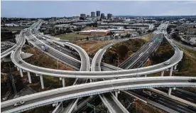  ?? JIM NOELKER / STAFF ?? Holiday travel in Ohio is expected to be near pre-pandemic levels. In Ohio, 1.9 million will be traveling on the roadways. This is a drone photo of the convergenc­e of U.S. 35 and Interstate 75 with the city of Dayton in the background.