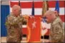  ?? PHOTO PROVIDED ?? Major Gen, Raymond Shields, left, unfurls his two star general officers flag with Command Sgt. Major David Piwowarski following his promotion on Thursday.