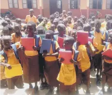  ?? ?? School starters at a Bawku primary school with new uniforms & stationery