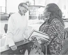  ?? Tribune News Service ?? Pastor Gloria White-Hammond speaks with a parishione­r after a Sunday service at Bethel AME Church in Boston.