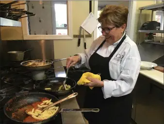  ?? PHOTOS BY JANET PODOLAK — THE NEWS-HERALD ?? Chef Loretta Paganini prepares most of the meals at Sapore herself.